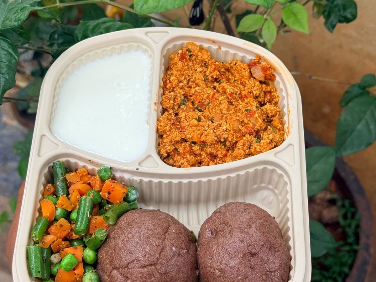 Paneer bhurji and ragi balls box: spiced paneer bhurji with two ragi finger-millet balls, yogurt and sautéed vegetables